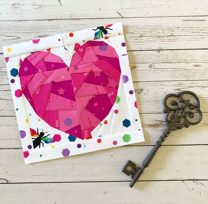 rainbow geometric heart paper pieced pattern sewn in pink fabrics