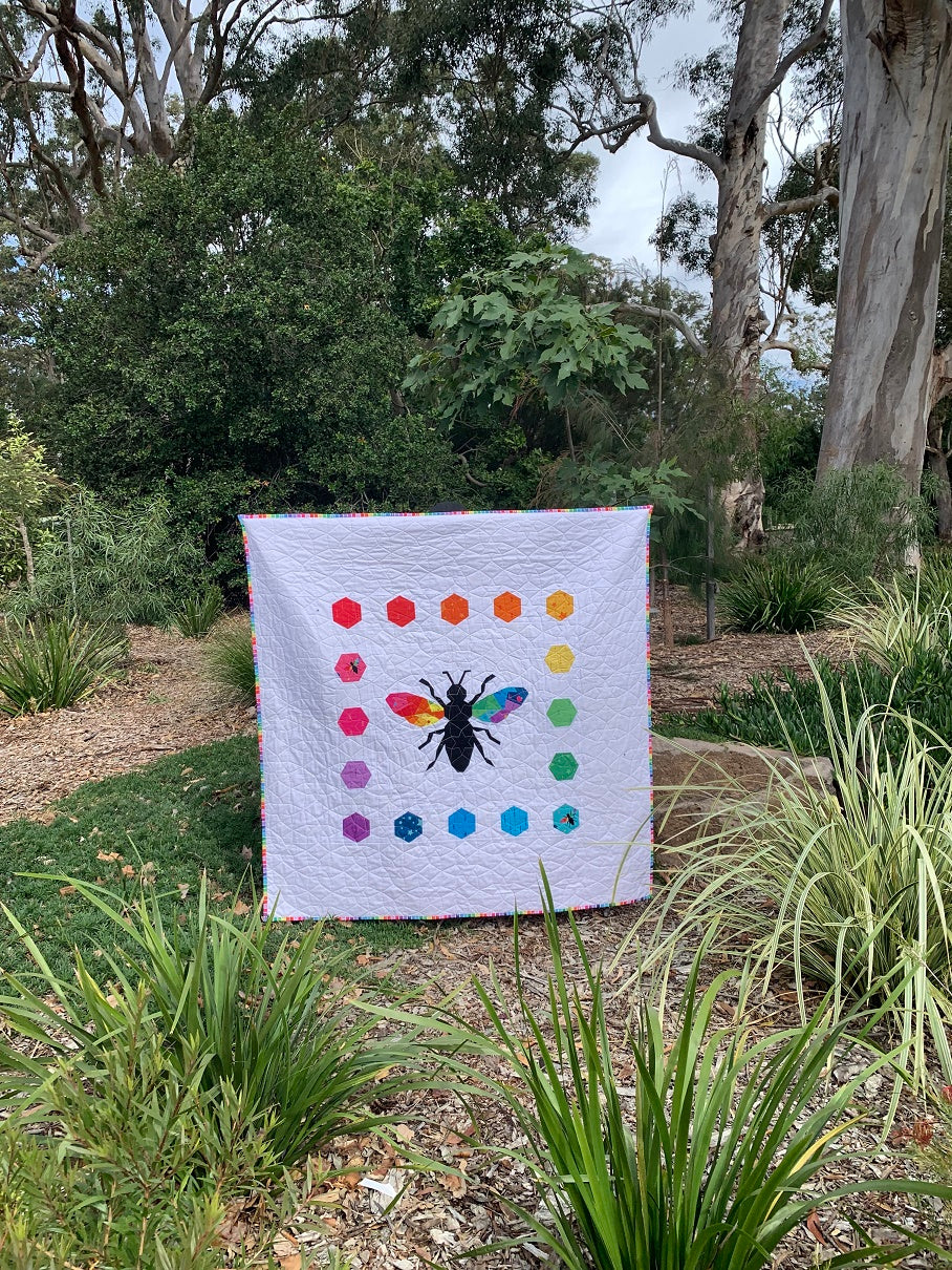 Hexie Bee quilt paper pieced pattern sewn in rainbow fabrics