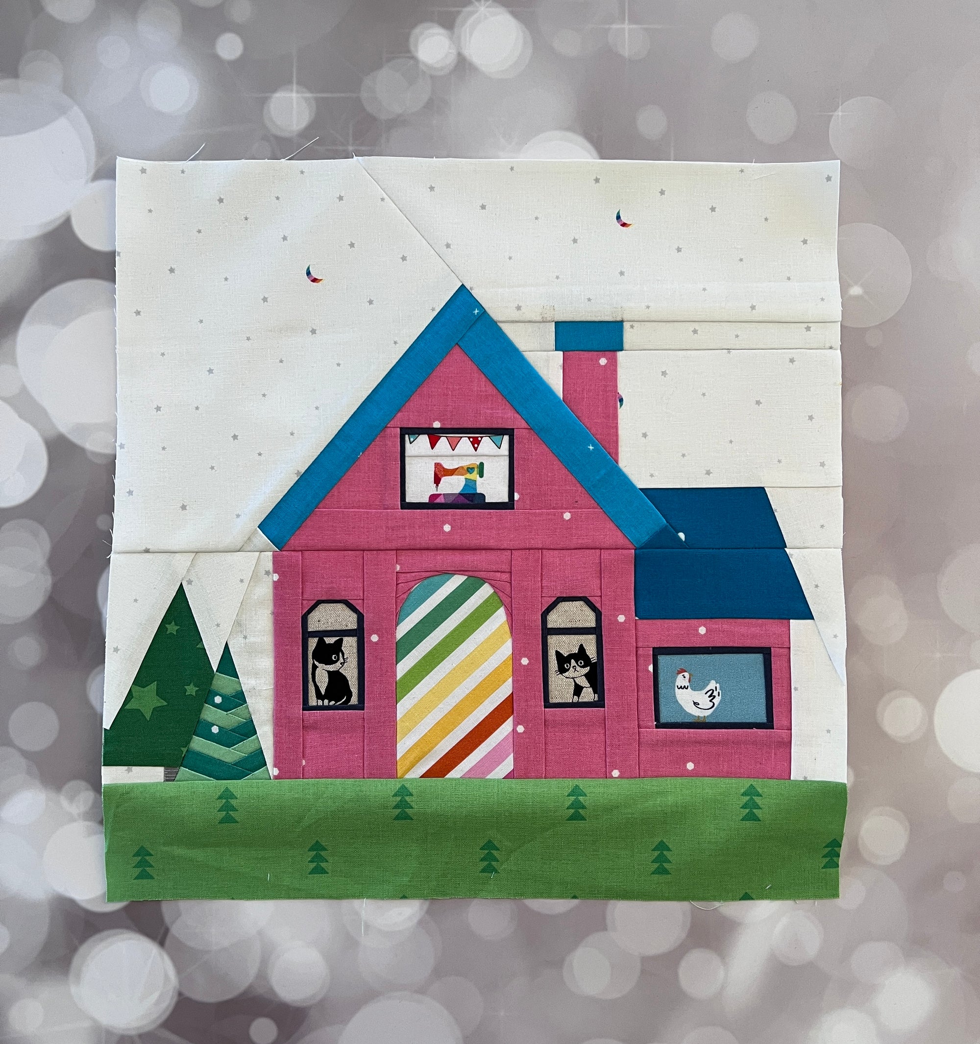 cosy cottage paper pieced pattern sewn in rainbow fabric