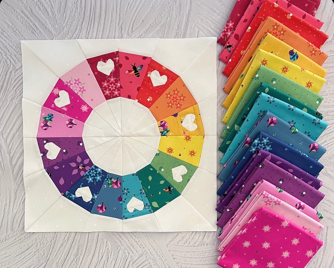 full circle rainbow wreath with hearts paper pieced pattern sewn in rainbow fabrics