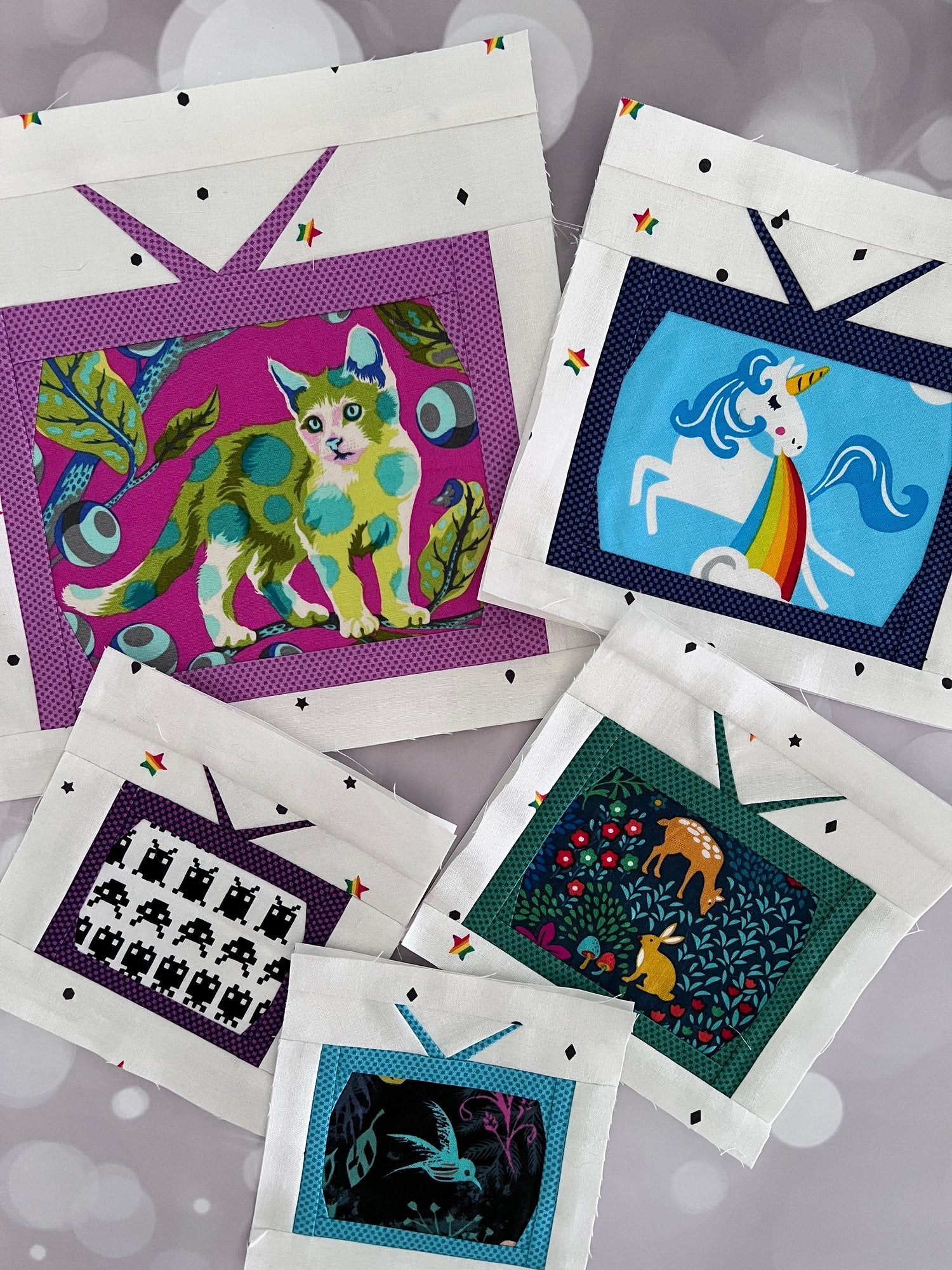 Foundation paper pieced tiny televisions in multiple sizes featuring fussycutting