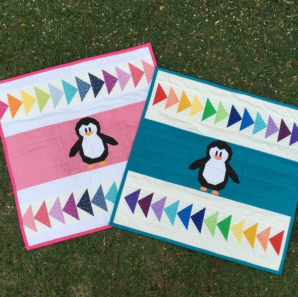 penguin paper pieced pattern made into a mini quilt with flying geese