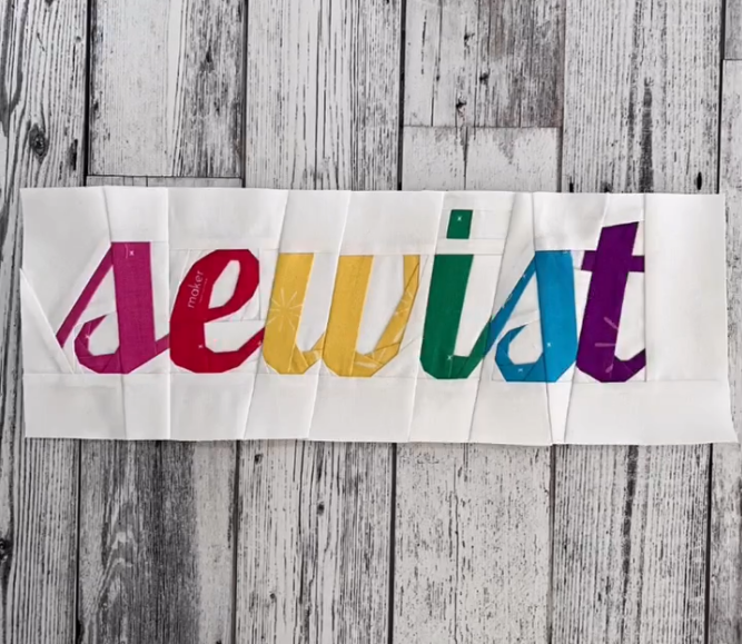 sewist in script paper pieced pattern sewn in rainbow fabric